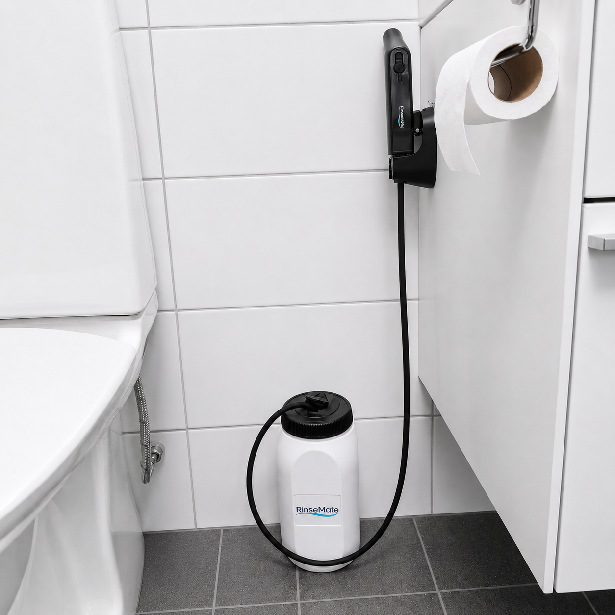RinseMate installed next to a toilet — no plumbing, no water line connection