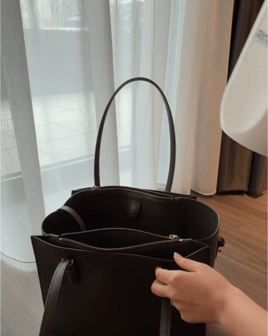 RinseMate packed in a tote bag — works everywhere with no plumbing needed.